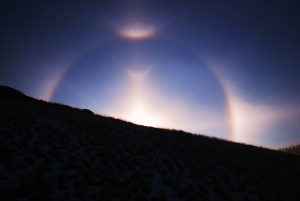 A diamond dust ice crystal enigma that forms a halo around the risng Sun in Colarado last week.